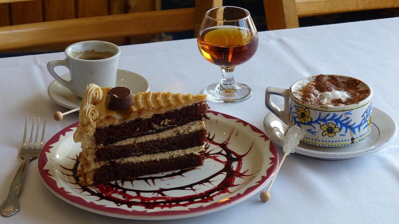 Peanut butter cake with coffee and after dinner drinks